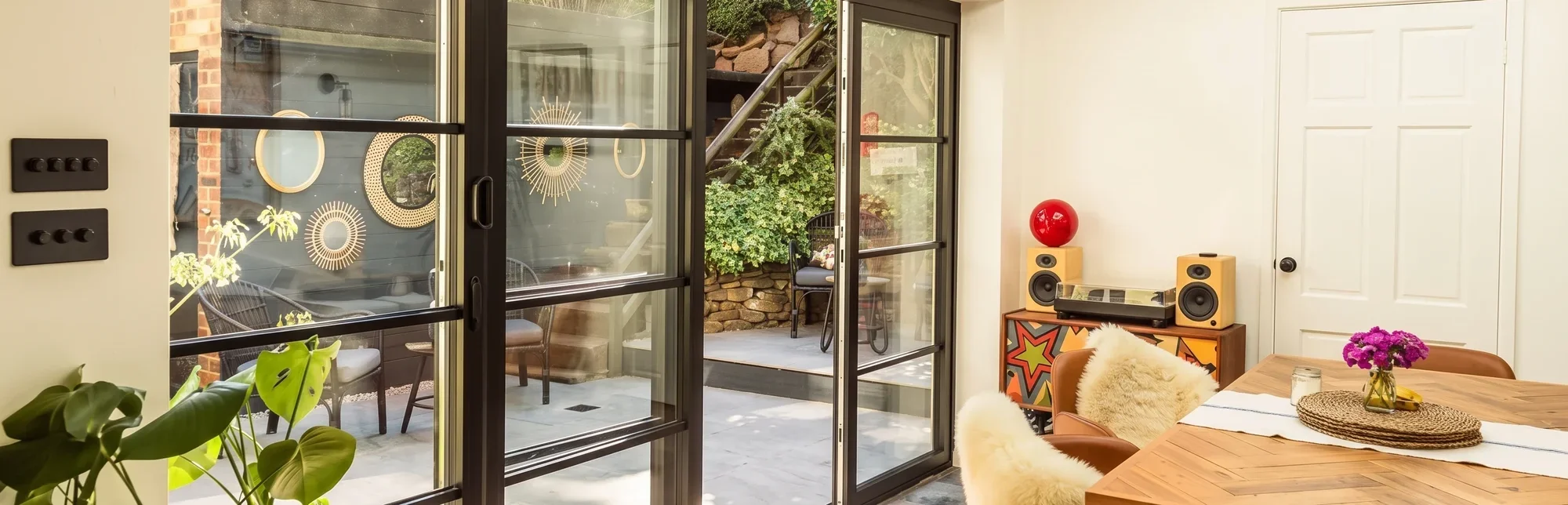 Aluminium heritage steel-look doors opening onto a garden, fitted by Windows Store Ltd