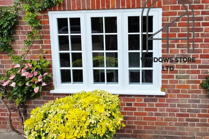 Timber casement windows with glazing bars in a London brick house, made by Windows Store Ltd